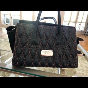 Valentine black leather handbag with stitching.